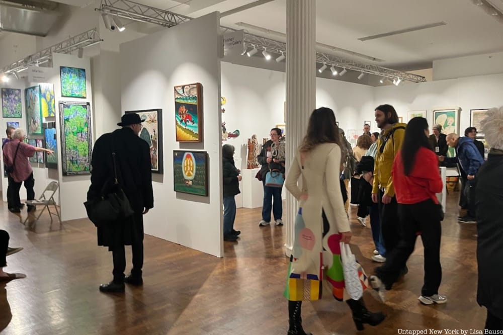 Crowds walk around the Outsider Art Fair galleries