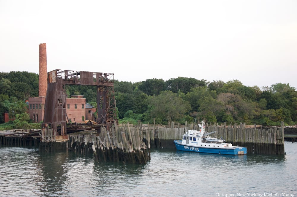 NYC Police boat docked at at gantry on the edge of North Brother Island