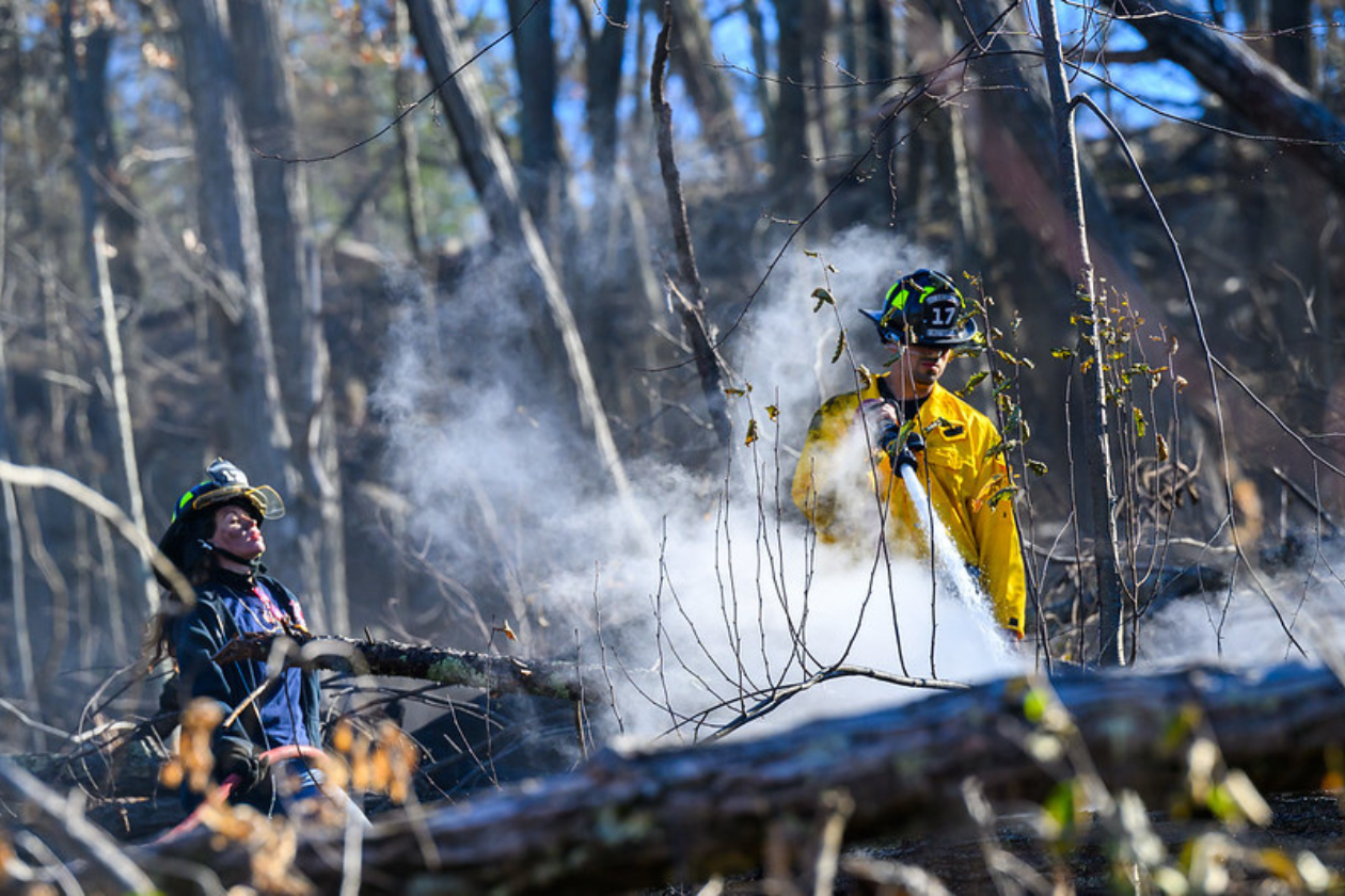 Firefighters battle a brushfire on Long Island