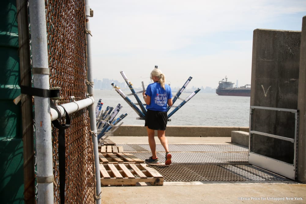 Woman carries fireworks mortars