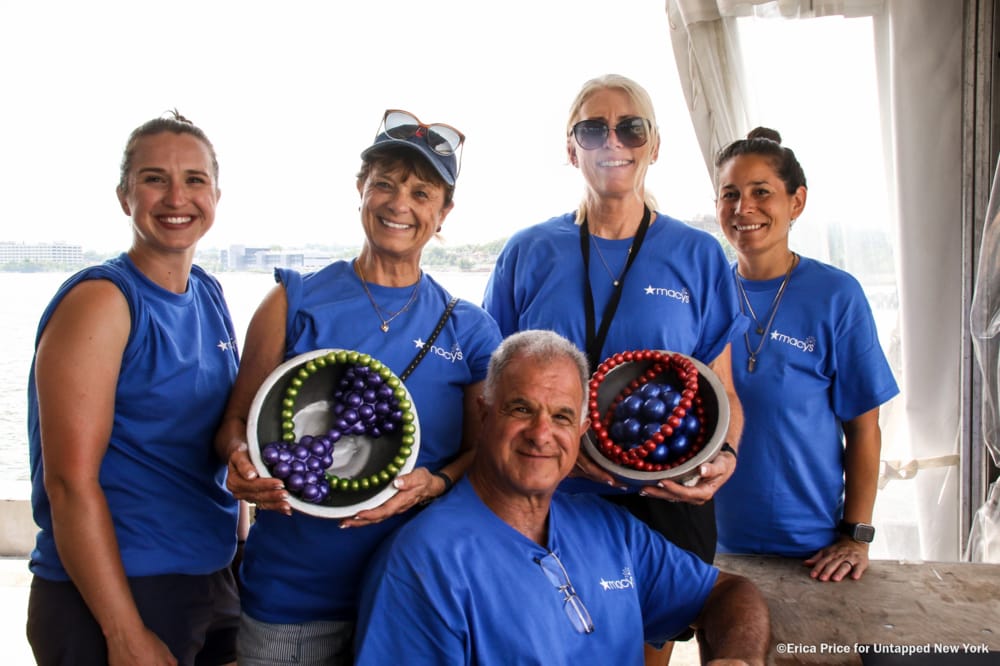 The Souza family holding two 4th of July fireworks shells