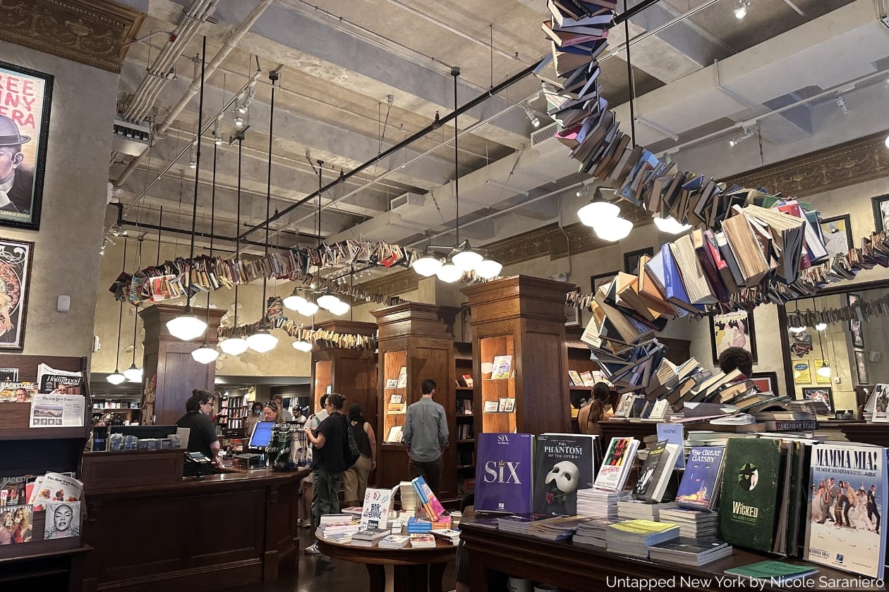 Interior of the Drama Book Shop with a floating snake of books curling around the ceiling