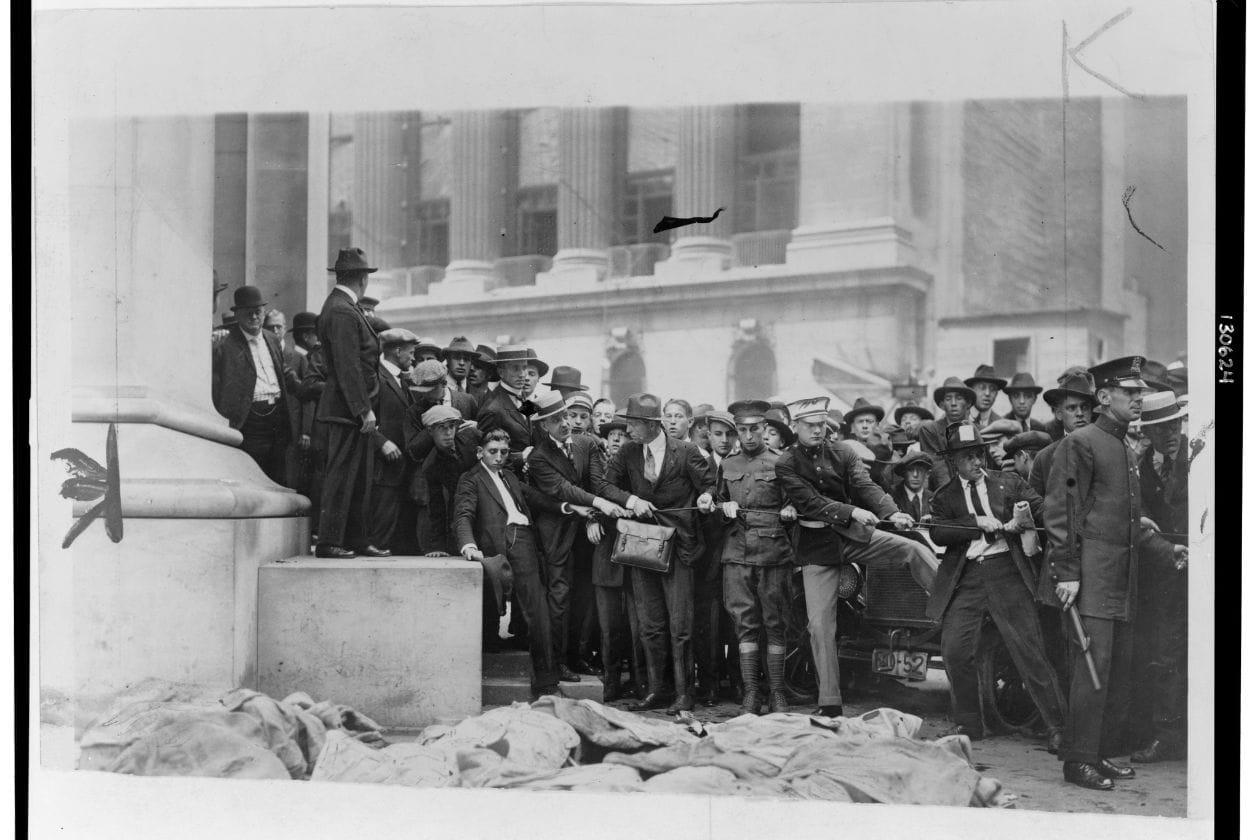 Crowds gather at site of an attack