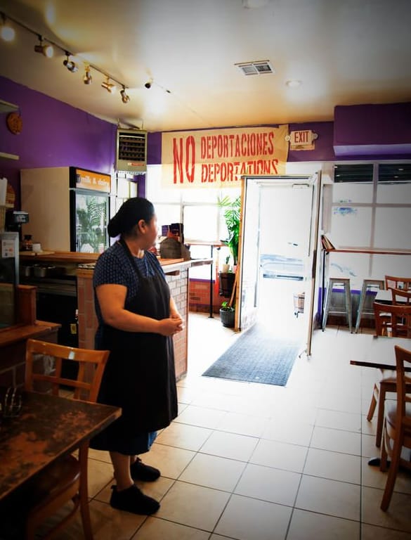 Woman standing in a restaurant