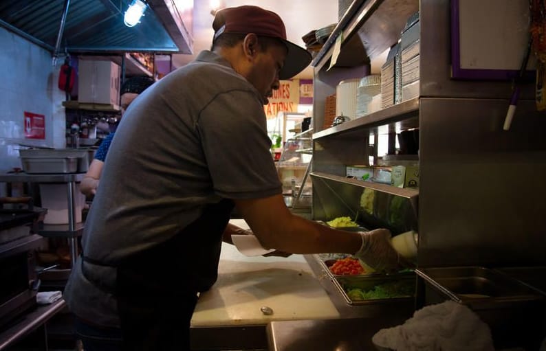 Man preparing food in a restaurant kitchen