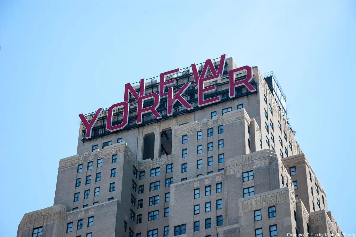 Red "New Yorker" sign atop the New Yorker Hotel in Manhattan