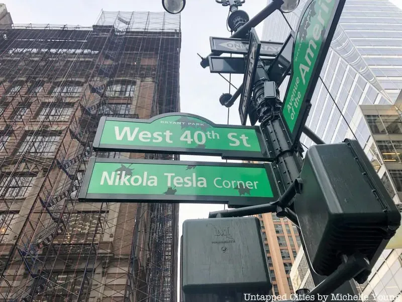 West 40th Street and Nikola Tesla Corner Street signs