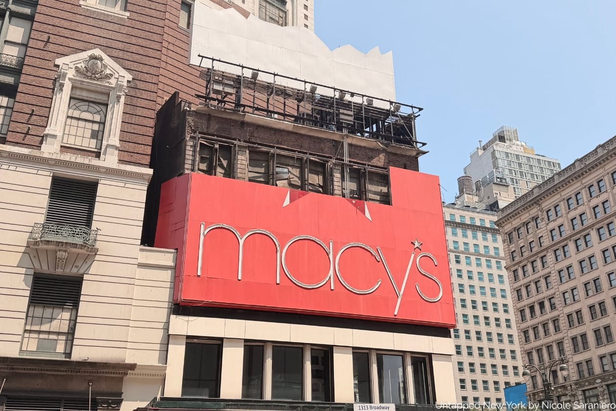 Macy's Herald Square Shopping Bag Sign being removed