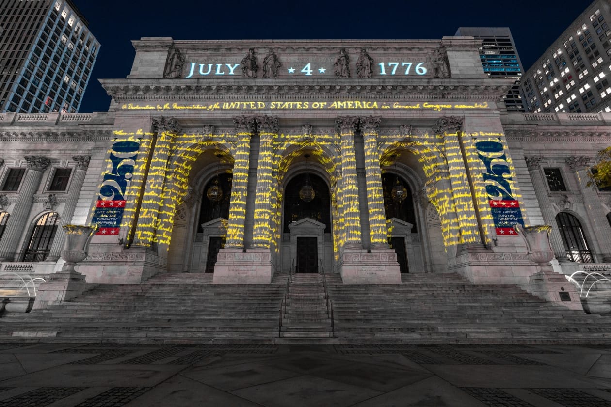 The Declaration of Independence projected onto the NYPL facade