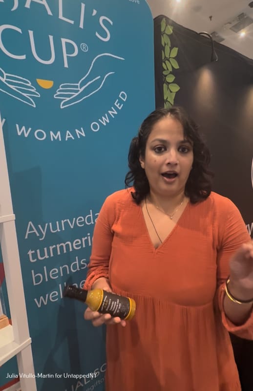 Anjali Bhargava, founder of Anjali's Cup, with a bottle of Catina Royal's habanera sauce.