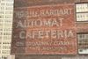 A ghost sign on a brick building that reads "Horn & Hardart Automat Cafeteria on Broadway corner in this building"