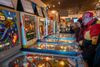 Untapped New York Insiders playing pinball at the Red Hook Pinball Museum