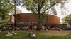 People picnic on the grounds of The Delacorte Theater