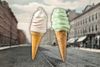 Two ice cream cones superimposed atop a postcard of Hoboken