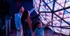 A family reaches out to touch one of the historic Times Square Balls at One Times Square