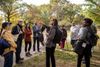 A tour group at the Seneca Village site in Central Park