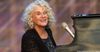 Carole King at the piano