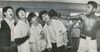 Muhammad Ali playfully pretends to punch The Beatles