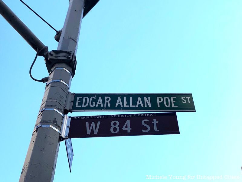 A green Edgar Allan Poe St. street sign
