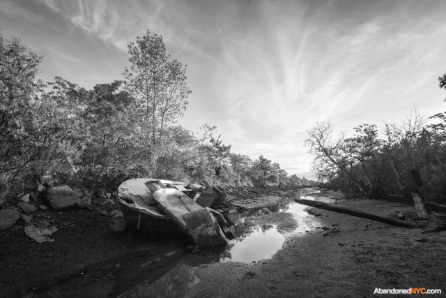 The sun sets on a creek at the north side of Gravesend’s secret park.