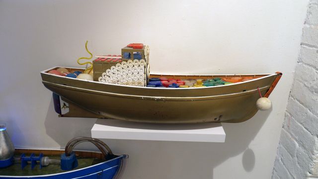 The boats are made from flotsam collected from the water