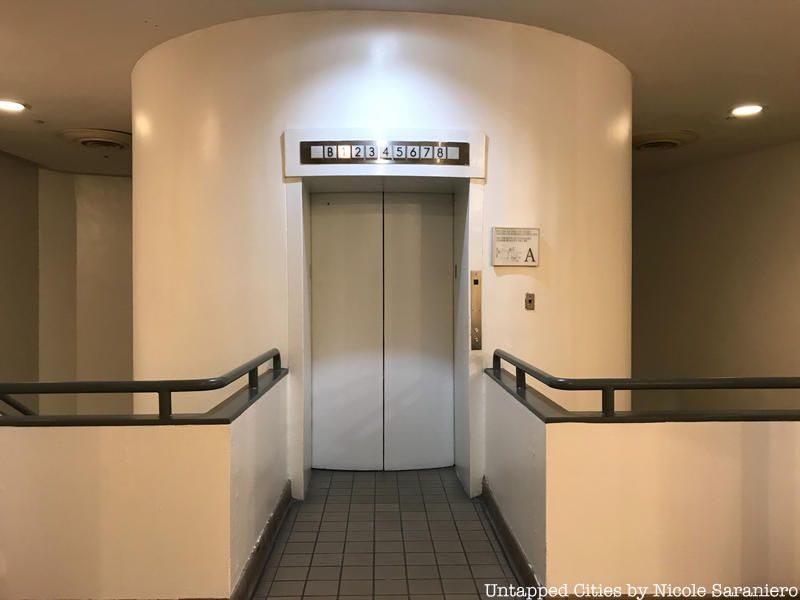 Interior elevator lobby at Cooper Union in the East Village, showing the cylindrical elevator shaft housing — built to accommodate a round cab, reportedly in anticipation of Otis's circular elevator design