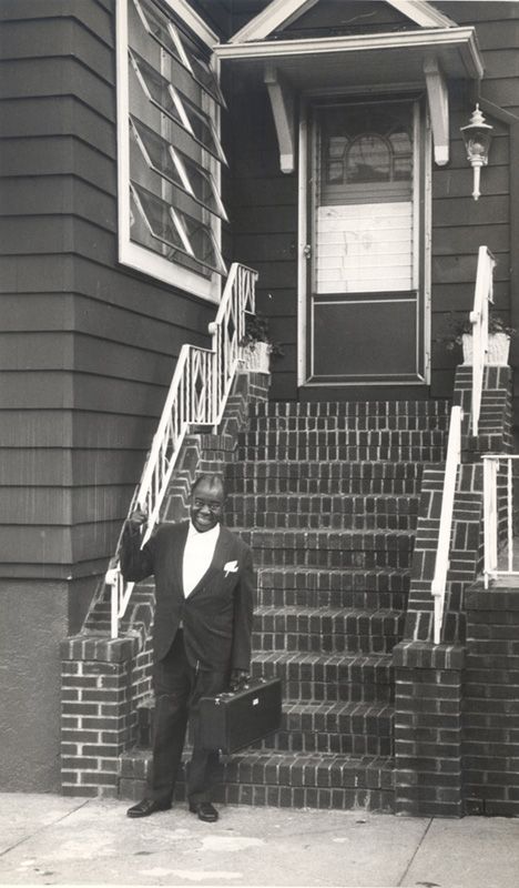 Louis Armstrong outside his Corona home