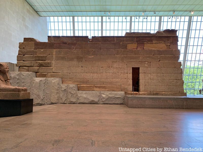 A side view of the Temple of Dendur where you can see the sloping granite platform meant to mimic the Egyptian hillside it once stood on.