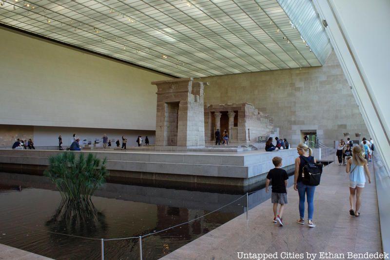 Visitors walk around the Temple of Dendur.