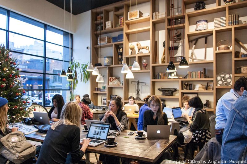 The bright open wooden shelves at Partner's Coffee