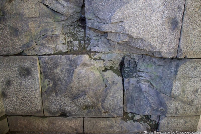 Bullet holes in a stone wall