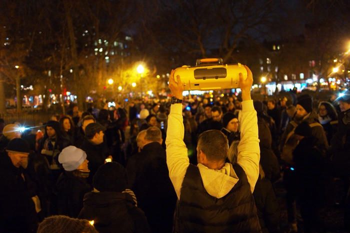 A crowd gathers with boomboxes for Phil Kline's Unsilent Night