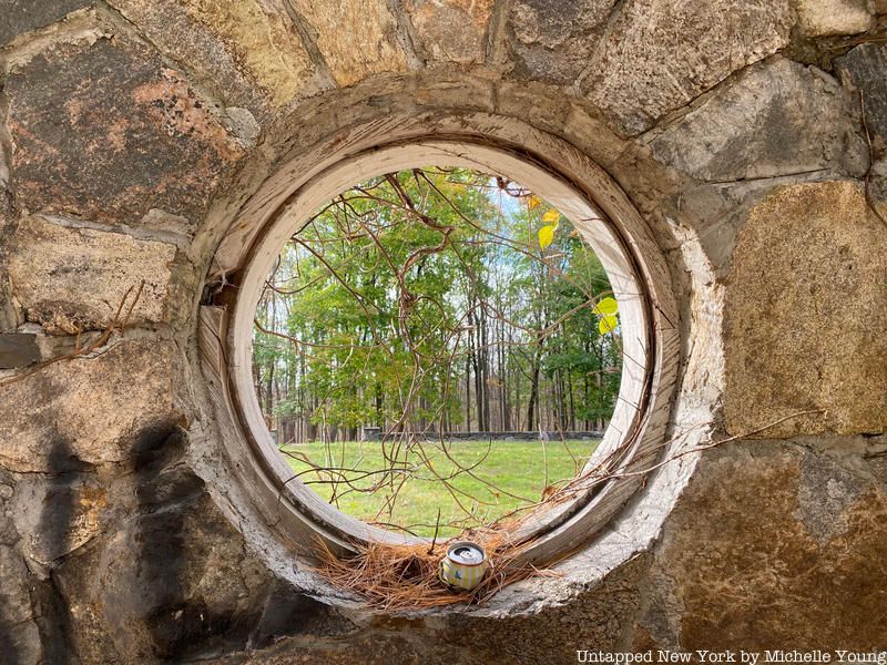 Circular window in abandoned stone ruin