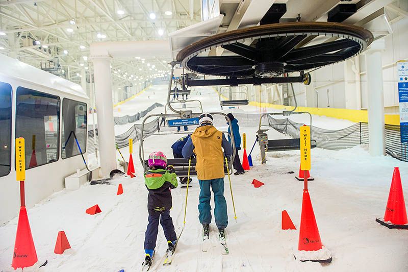 skiiers getting on lift