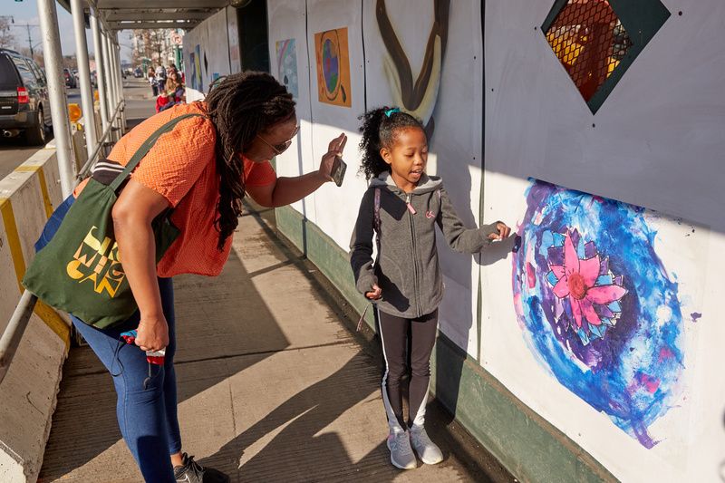 Accompanying Tomashi's mural are artistic responses from NYC youth ages 3-12. Photo by JJ Shulin.