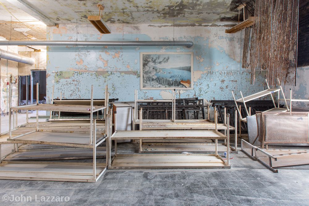 Tables stacked up in room at former Buffalo State Hospital