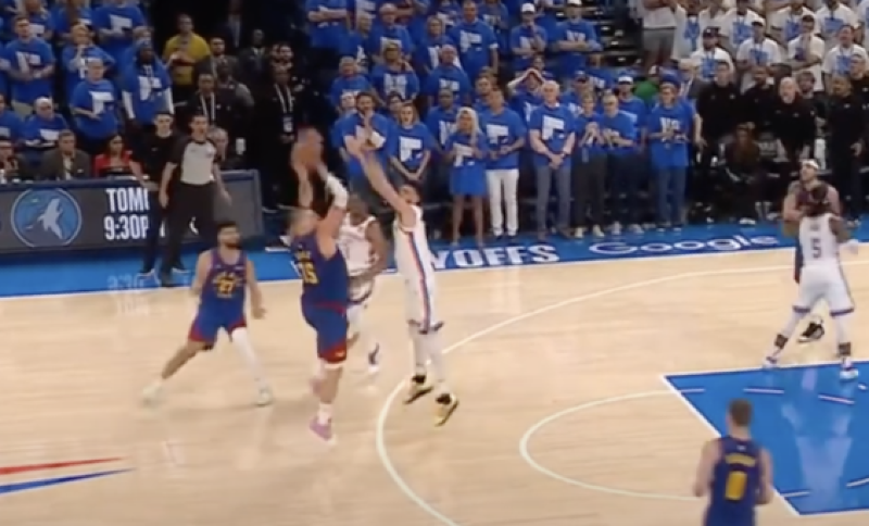 Nikola Jokić executes a clutch turnaround fadeaway three-pointer over Chet Holmgren in Game 5