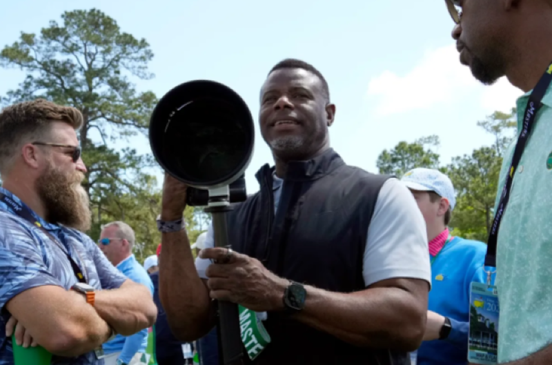 Ken Griffey Jr. photographing at the 2025 Masters Tournament at Augusta National Golf Club.