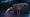 A Karambit | Fade knife with a pink-to-orange gradient blade next to a dark CS2 weapon case, representing knife drop odds in case opening.