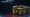 Two dark CS2 Kilowatt weapon cases with electric-yellow lightning trim, one with its lid slightly open.