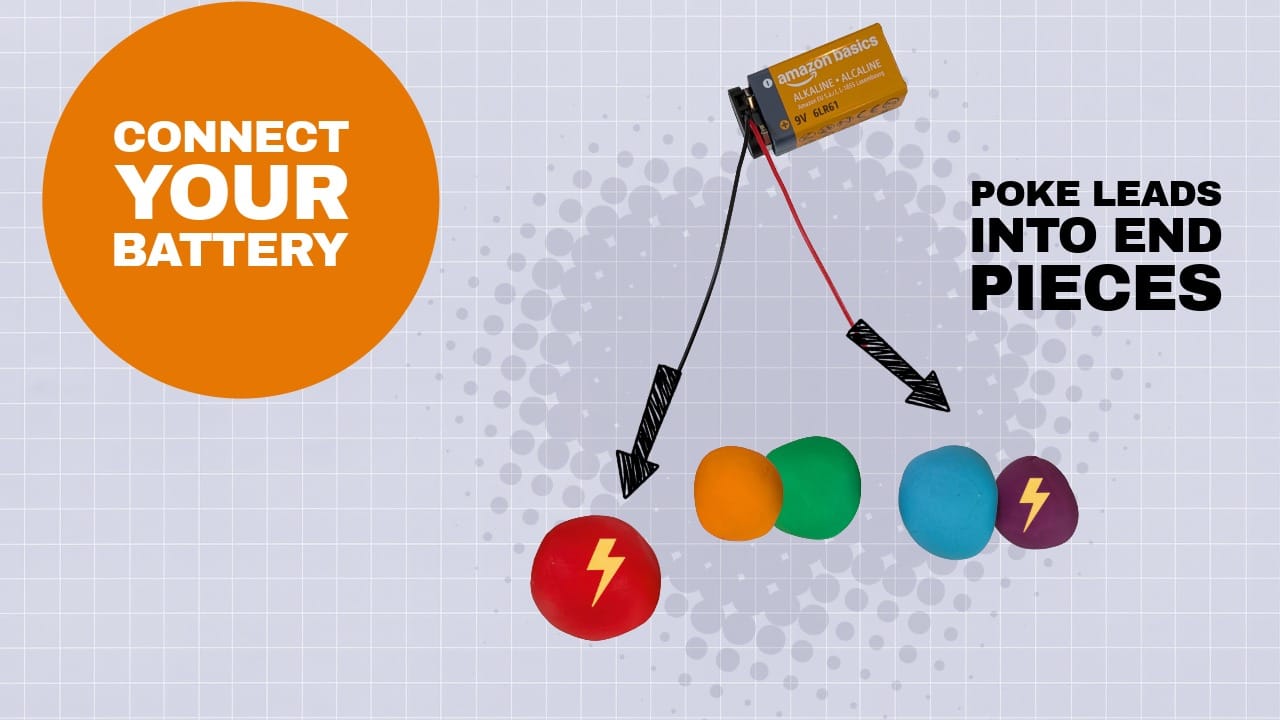 The black lead is connected to the front of the caterpillar dough, and the red lead to the back of the caterpillar dough. 