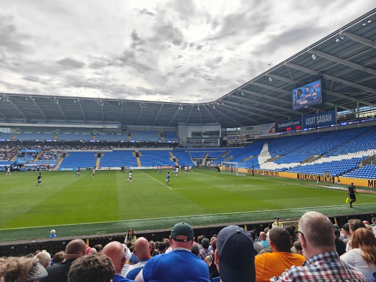 A photo from a football match between Cardiff City and Swindon Town at the Cardiff City Stadium; Cardiff, in blue, are attacking Swindon's goal