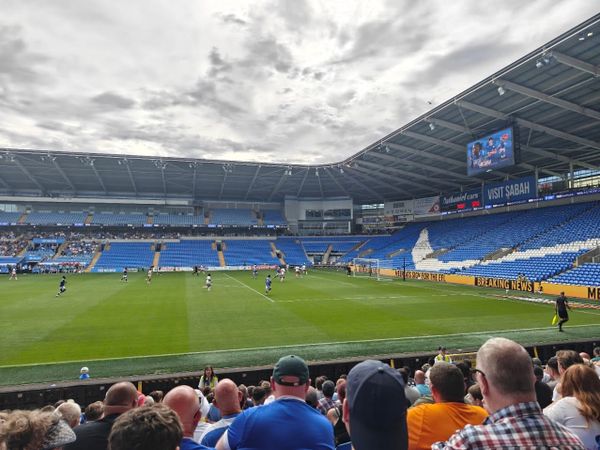A photo from a football match between Cardiff City and Swindon Town at the Cardiff City Stadium; Cardiff, in blue, are attacking Swindon's goal