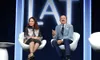 Two guests take part in an on-stage conversation beneath L'ATTITUDE signage at the 2024 conference in San Diego.