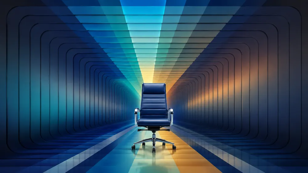 An empty dark blue leather executive chair sits centered in a symmetrical tunnel of blue-to-amber light, a conceptual image of an open seat of board leadership.