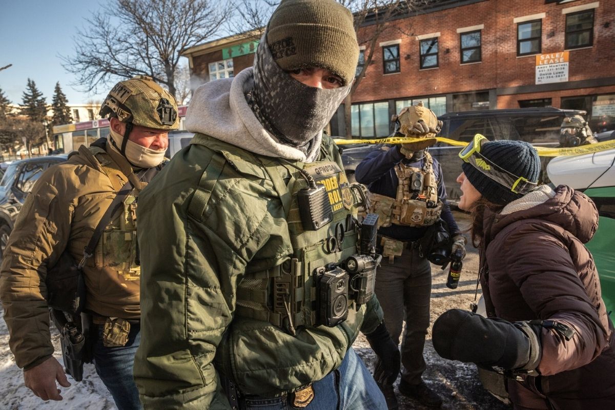 Federal immigration officers wearing body cameras during operations in Minneapolis