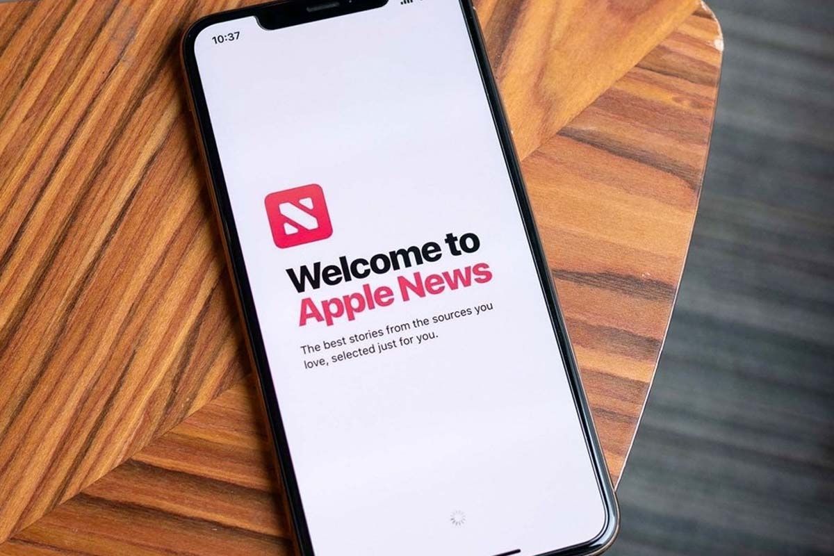 Apple News app displayed on an iPhone screen highlighting news headlines amid political bias controversy.