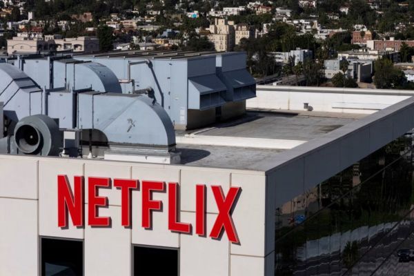 Netflix logo displayed on screen as US Department of Justice reviews antitrust concerns over Warner Bros merger