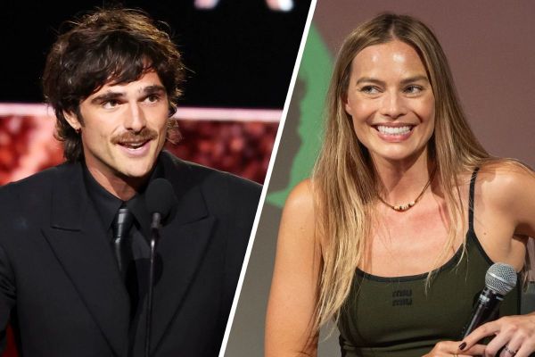 Margot Robbie and Jacob Elordi posing together at the Wuthering Heights premiere during the film’s press tour.