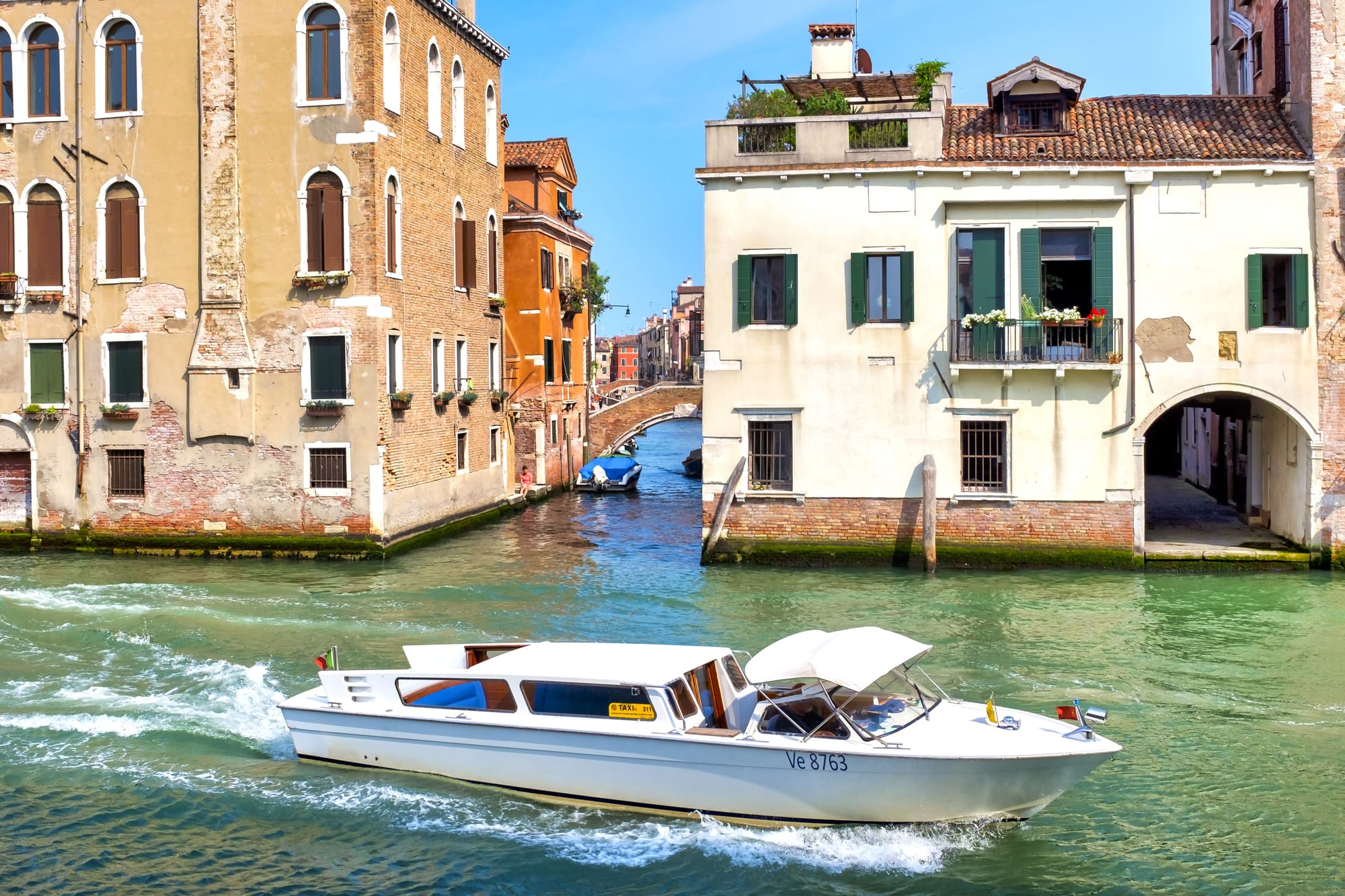Water Taxi Meandering Down The Venice Canals